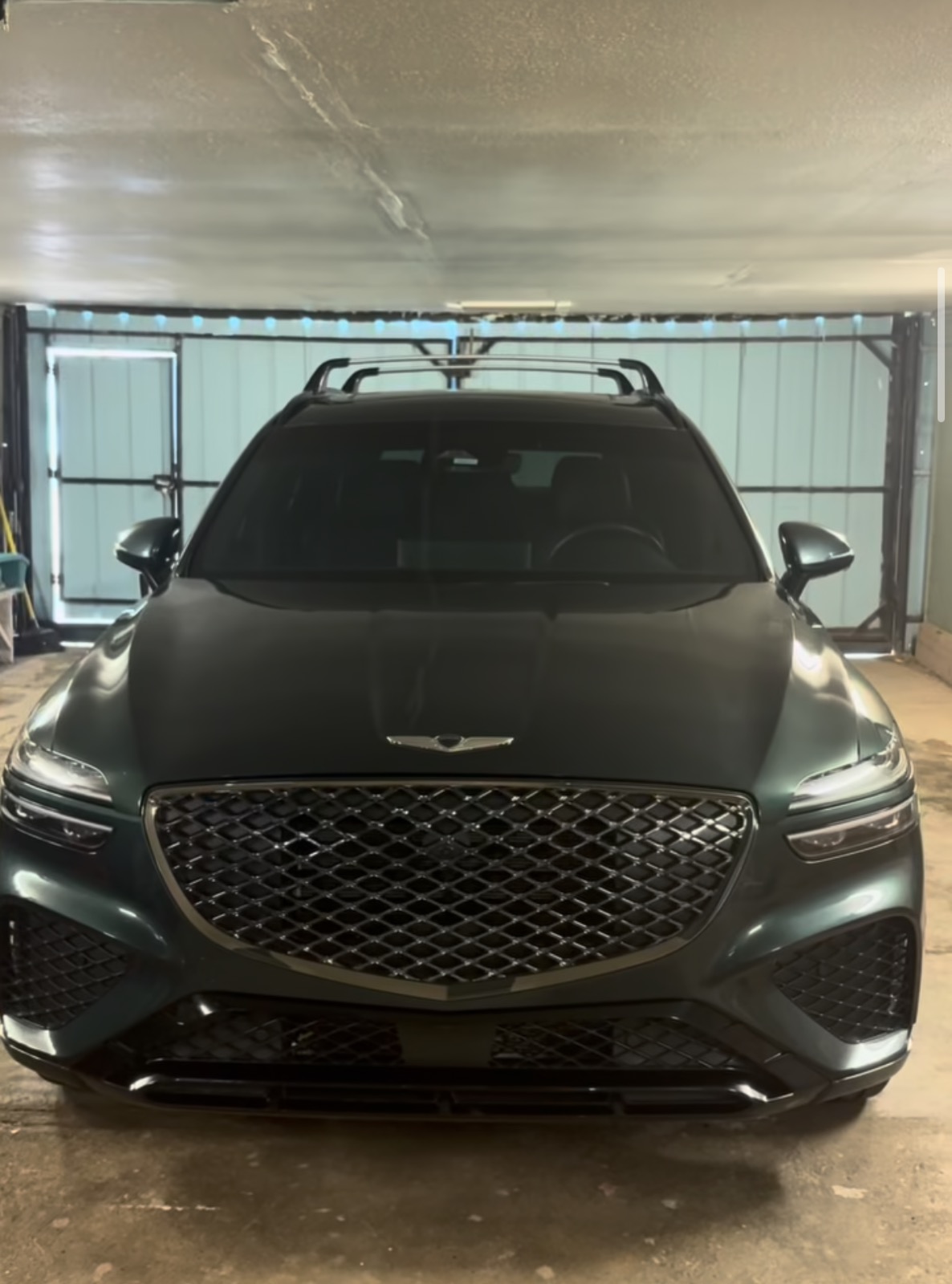 Dark green Genesis SUV detailed by AutoShine in Hooker, OK